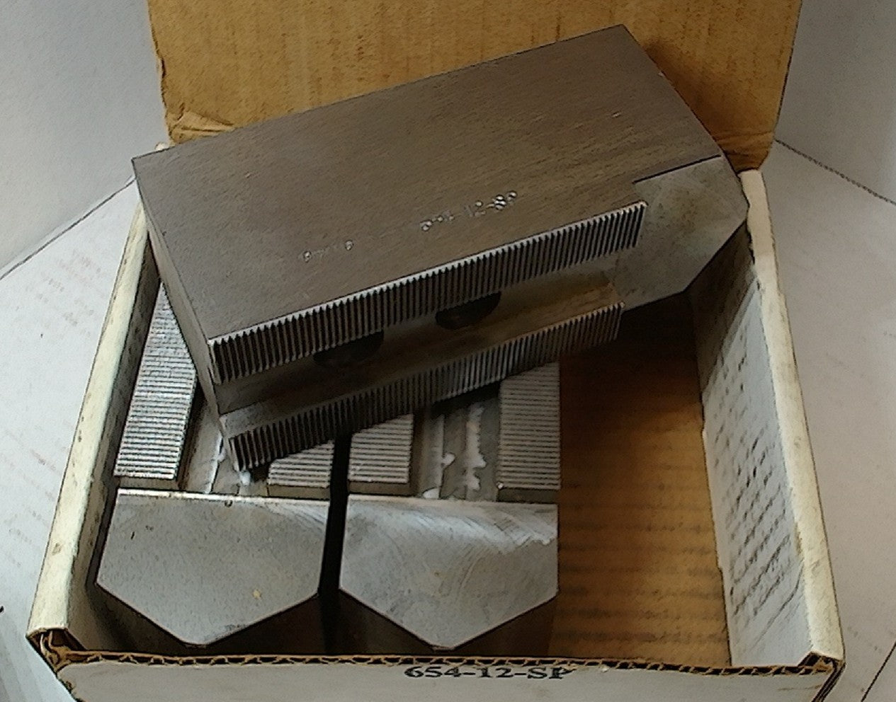 Lot 250-1036 Steel lathe soft jaws 1.125 between bolts with 1.0 mm serrations